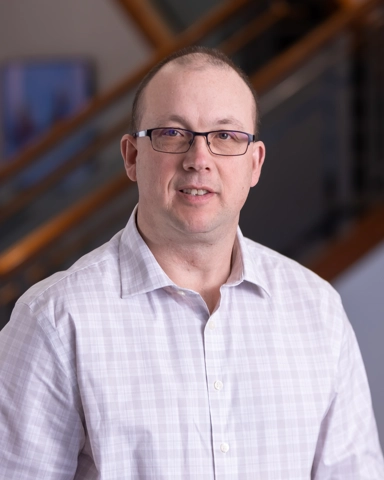 portrait of a smiling man in professional attire